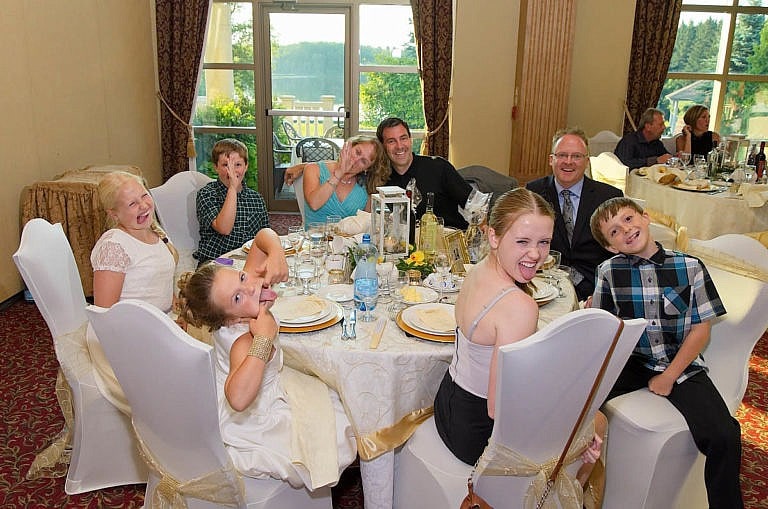 Funny faces during table shot at Royal Ambassador wedding