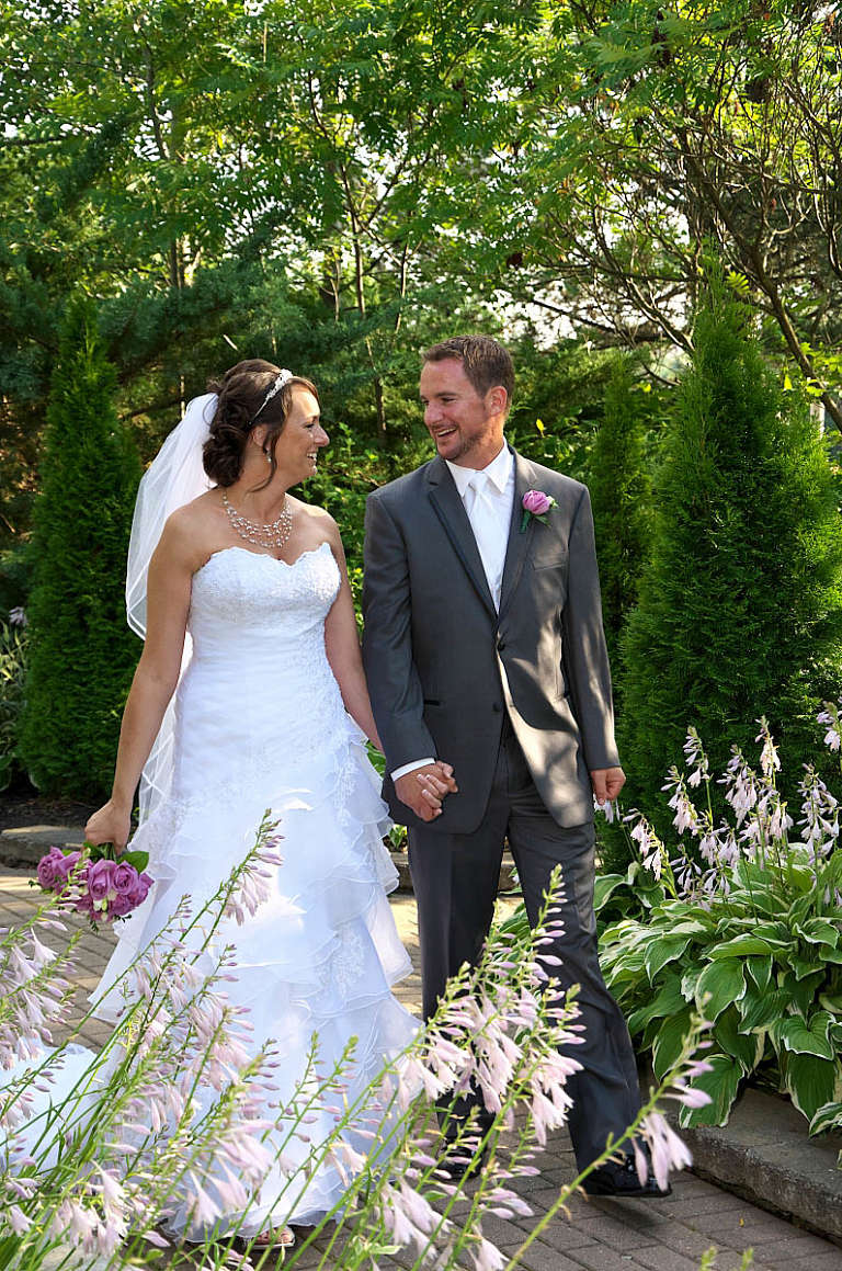 bride and groom hand in hand nottawasaga