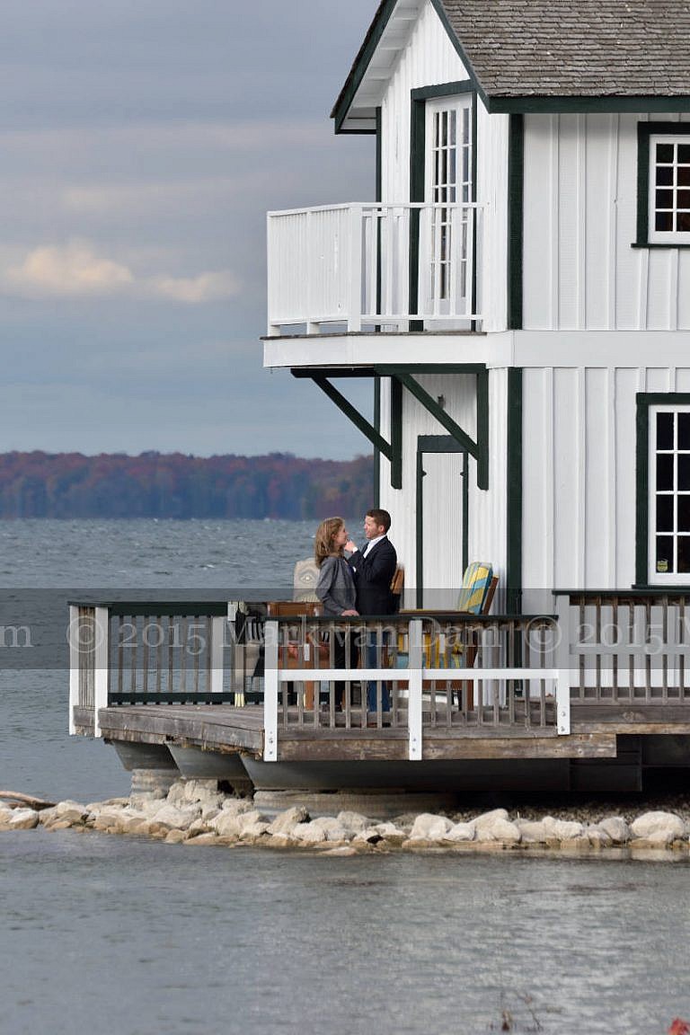 Stylish couple on boathouse deck at Leacock Museum engagement photography session