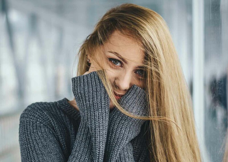 bride on hood of cherry red vintage thunderbird