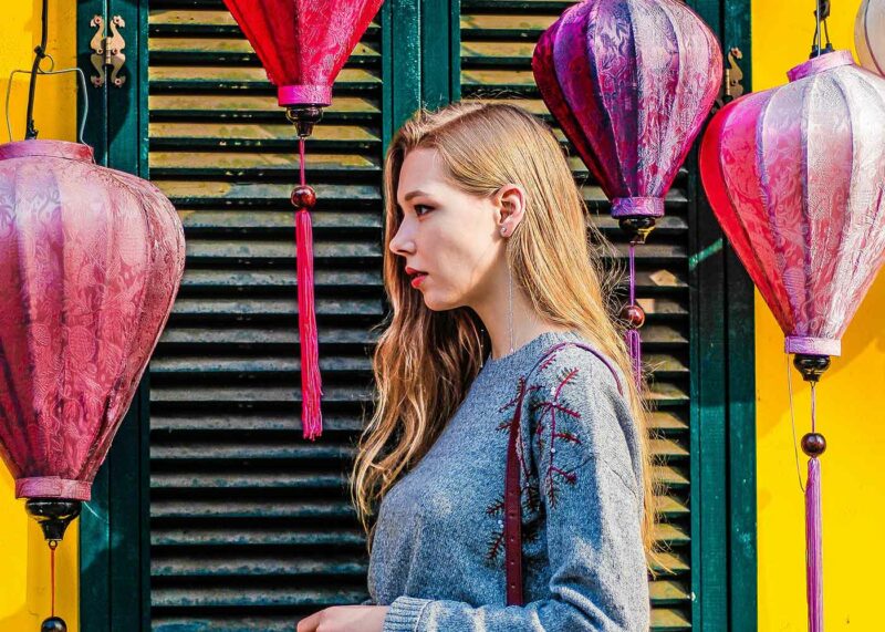 bride on hood of cherry red vintage thunderbird