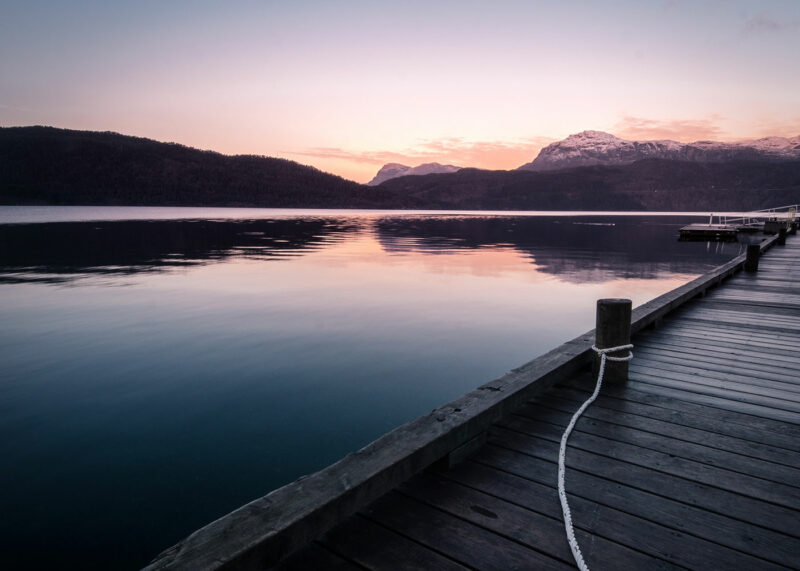 bride on hood of cherry red vintage thunderbird