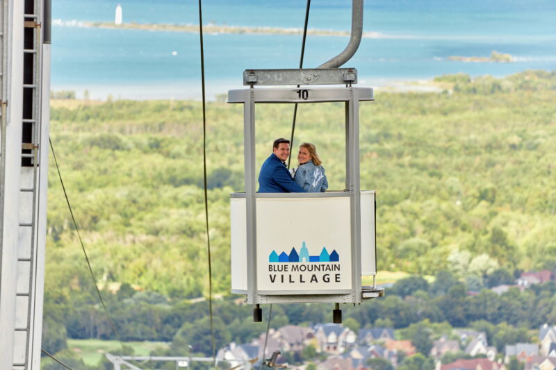 Bride and Groom Riding Gondola Down Blue Mountain