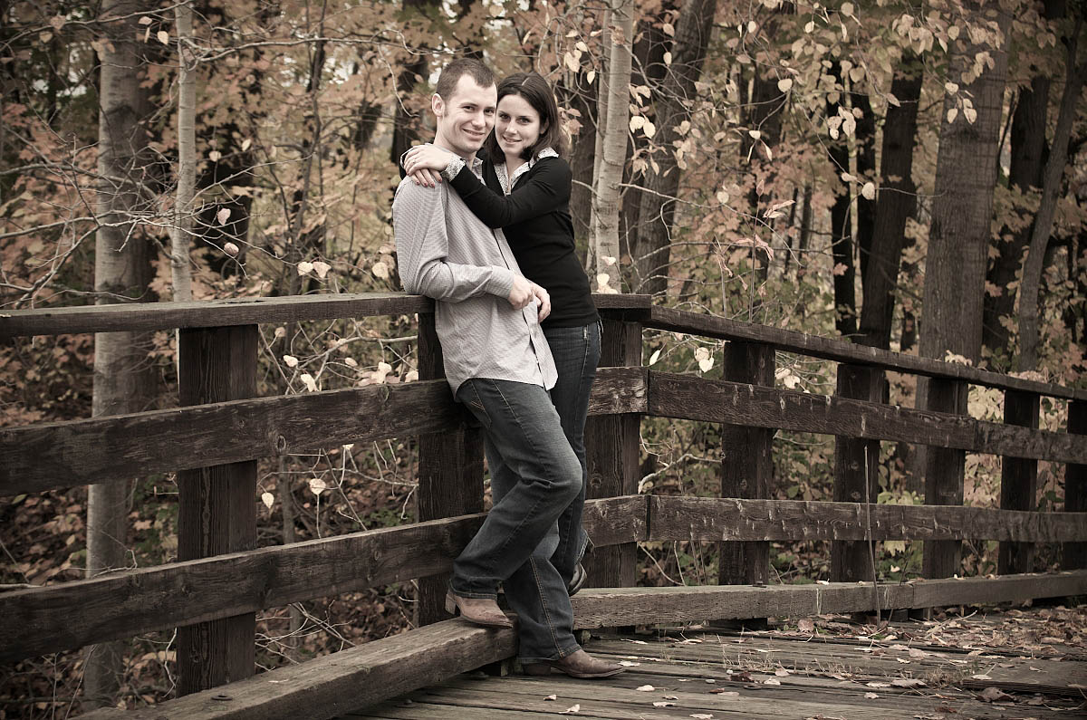 Young couple on wooden bridge over Omemee Rail Trail