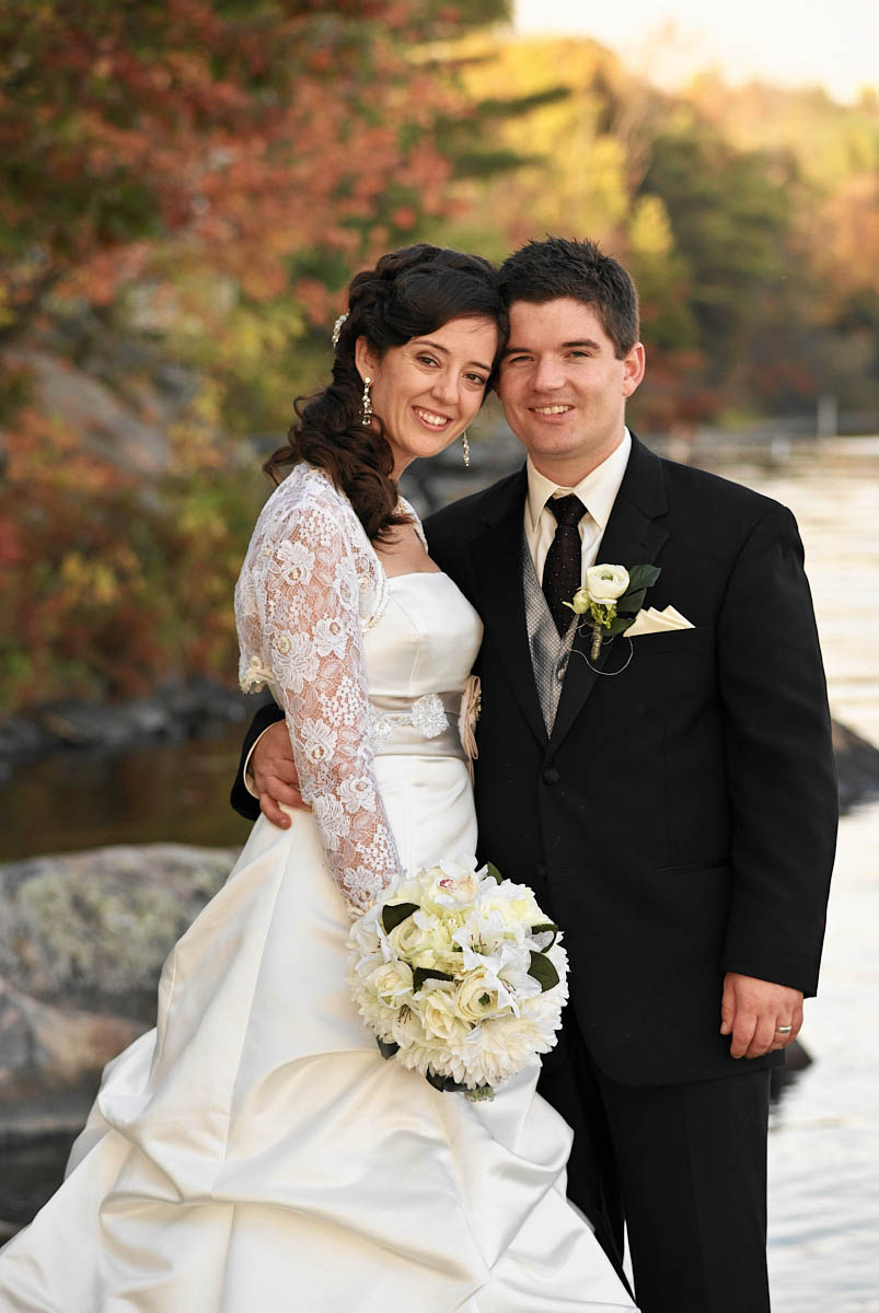 bride and groom by stoney lake at kawartha lakes wedding on stoney lake at viamede resort