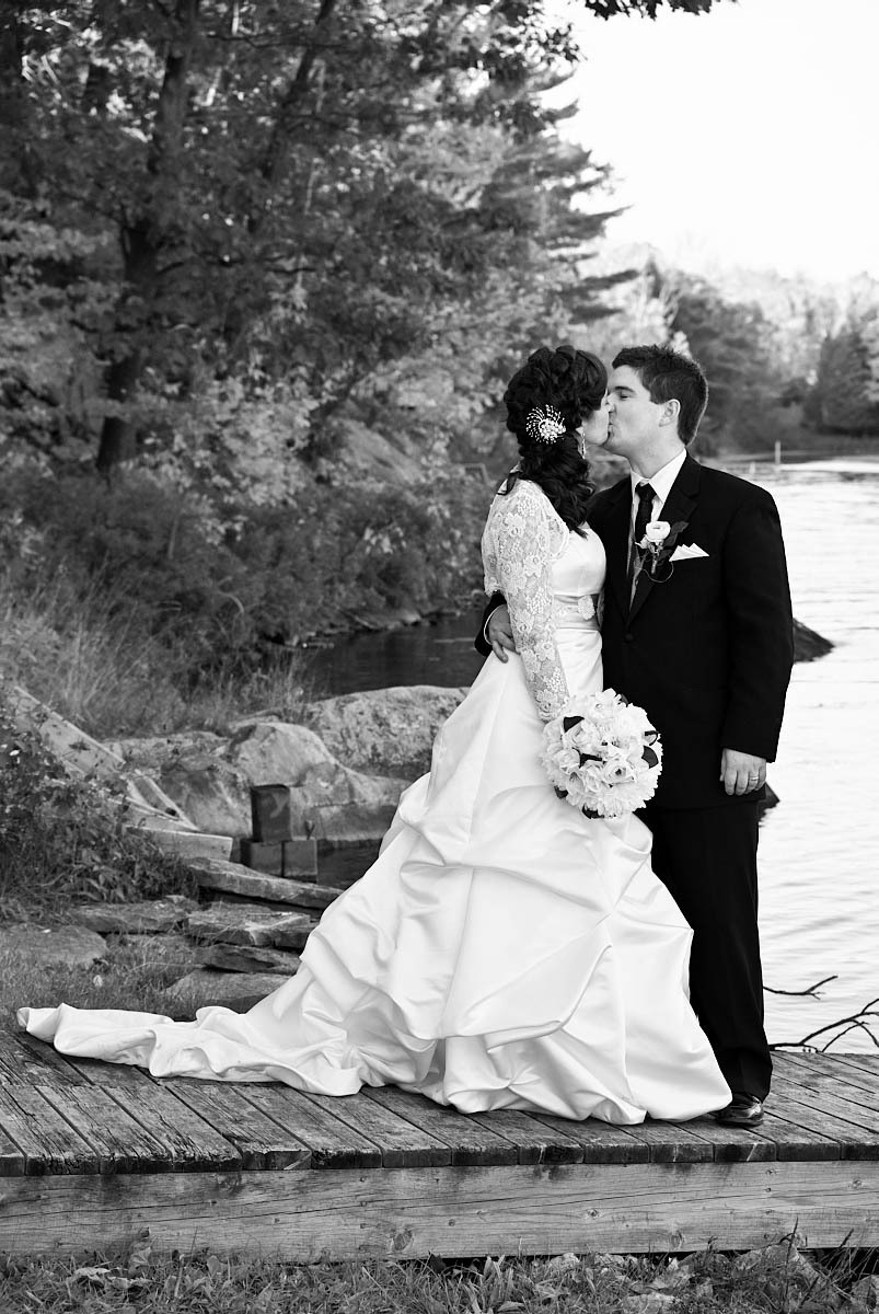 bride and groom by stoney lake at kawartha lakes wedding on stoney lake at viamede resort