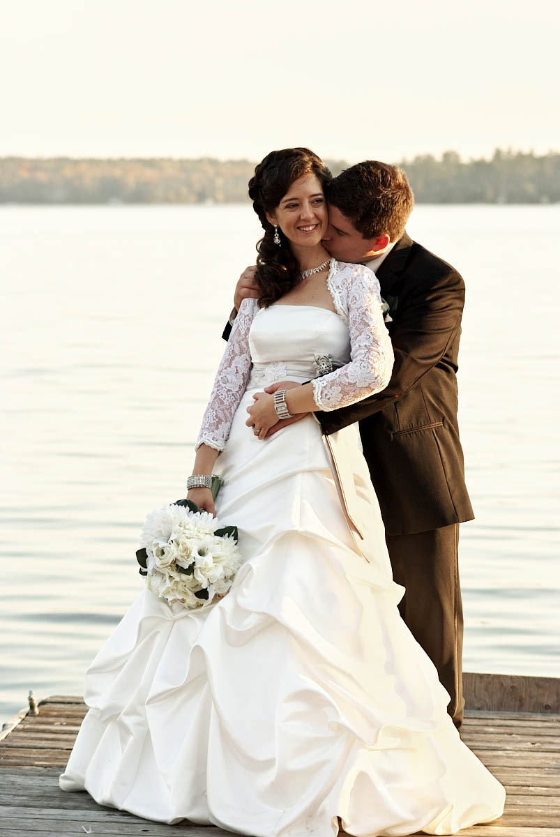 bride and groom on dock at viamede resort wedding