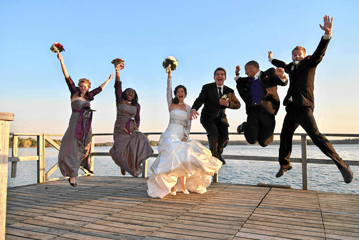wedding party on dock at viamede resort wedding