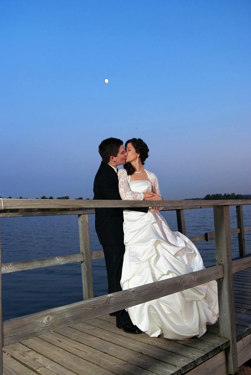 bride and groom on dock at night at viamede resort wedding