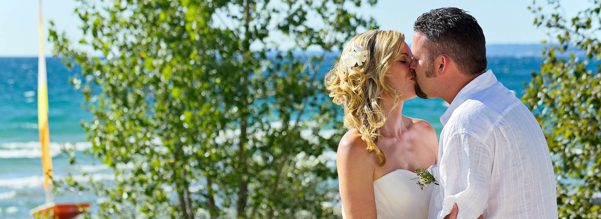Bride and Groom Kissing with Georgian Bay behind