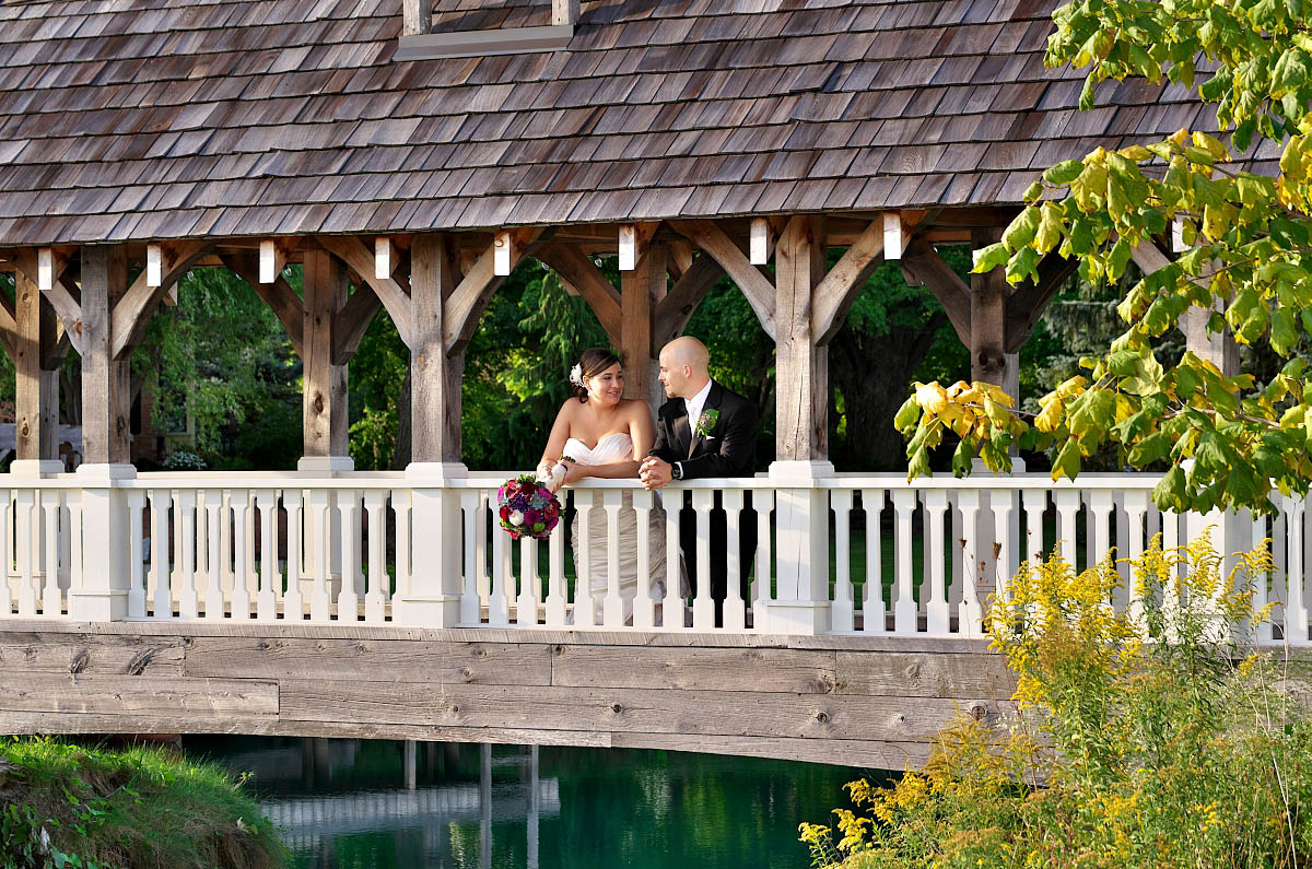 bride and groom alone on bridge