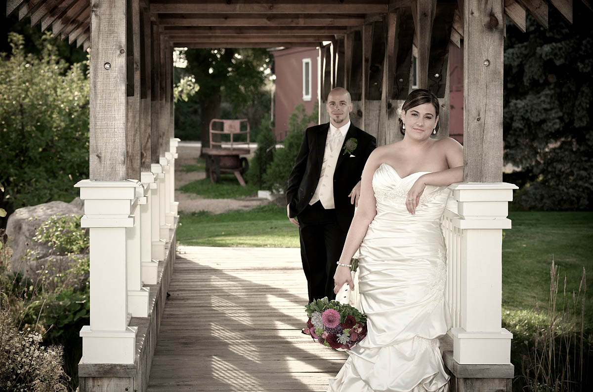 bride and groom strike a stylish pose