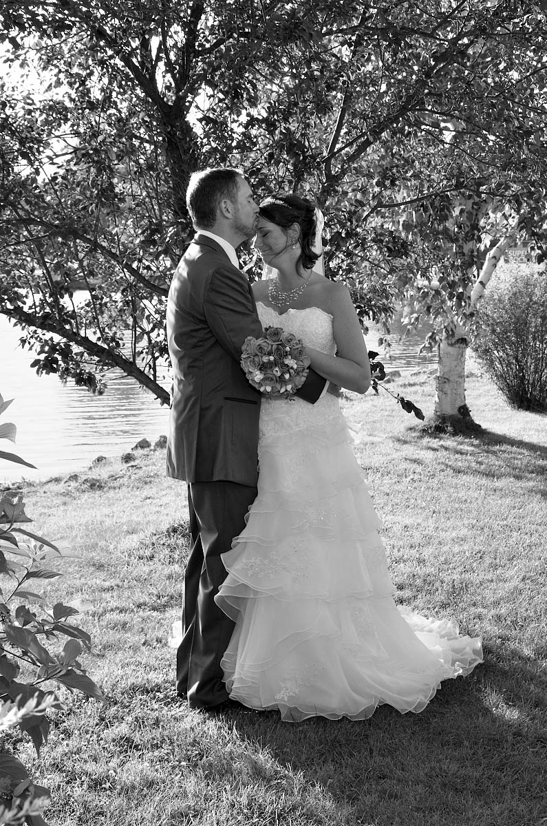 groom kisses bride on head nottawasaga