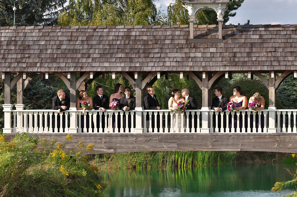 wedding party on belcroft tree farm covered bridge