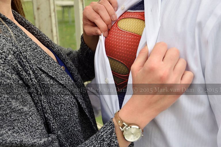 cleark kent turning into superman during Orillia engagement photography session