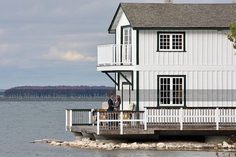 Stylish couple on boathouse deck at Leacock Museum engagement photography session