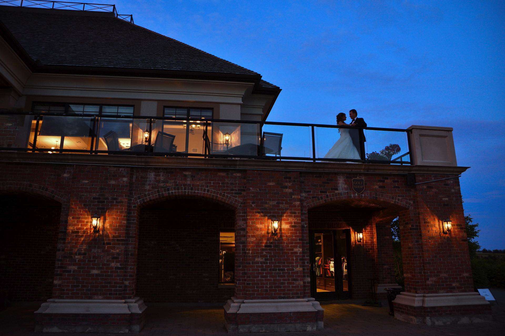 Stylish wedding couple on terrace at the Club at Bond Head wedding at night