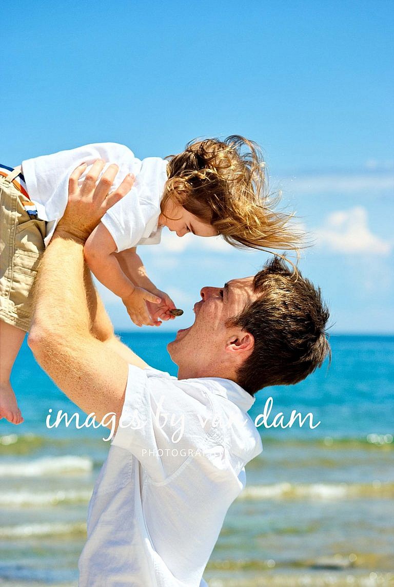 A young father lifts his Jubilant Son at a Collingwood Portrait Session