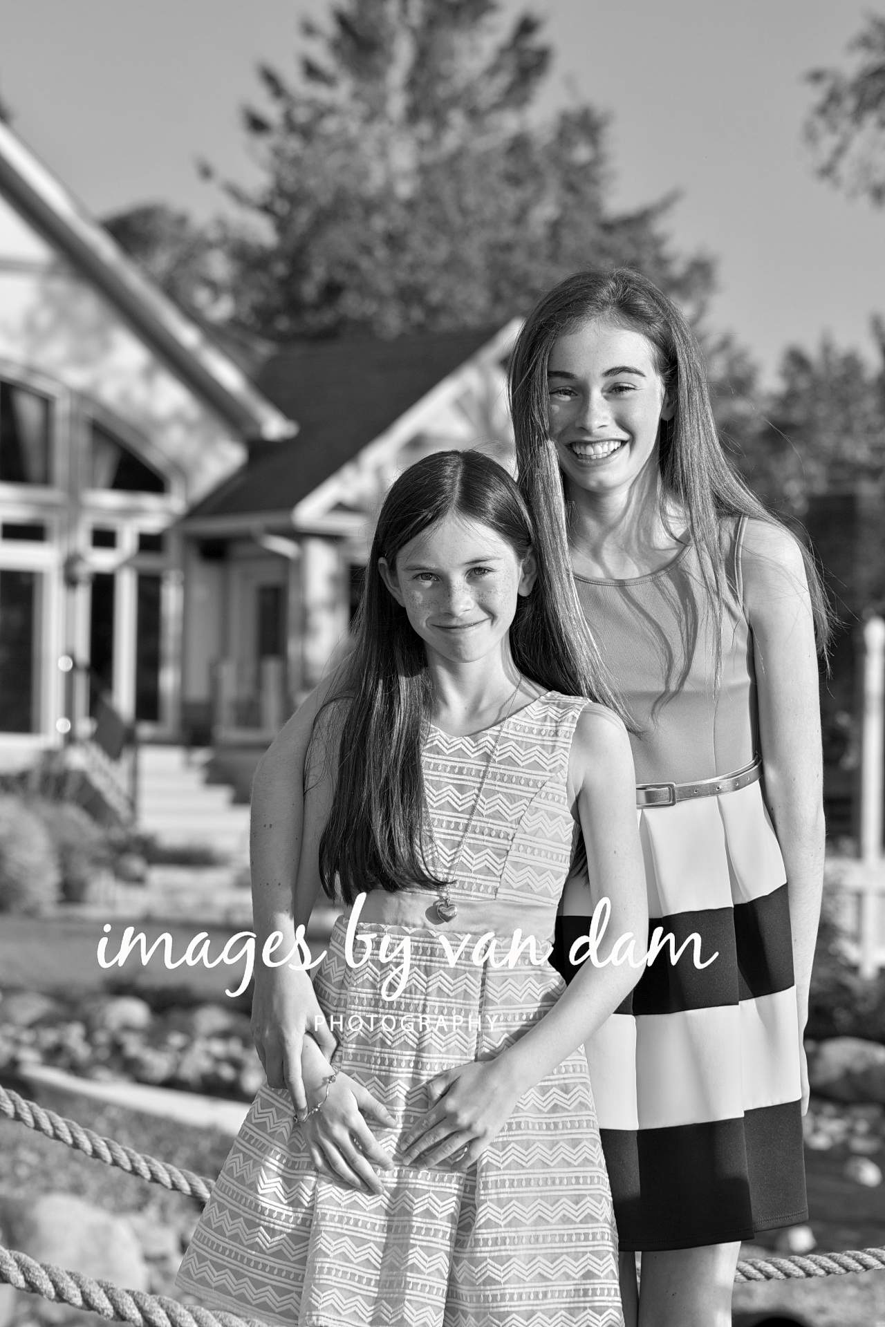 Sisters Smile in front of their home in Collingwood collingwood photographer collingwood portraits