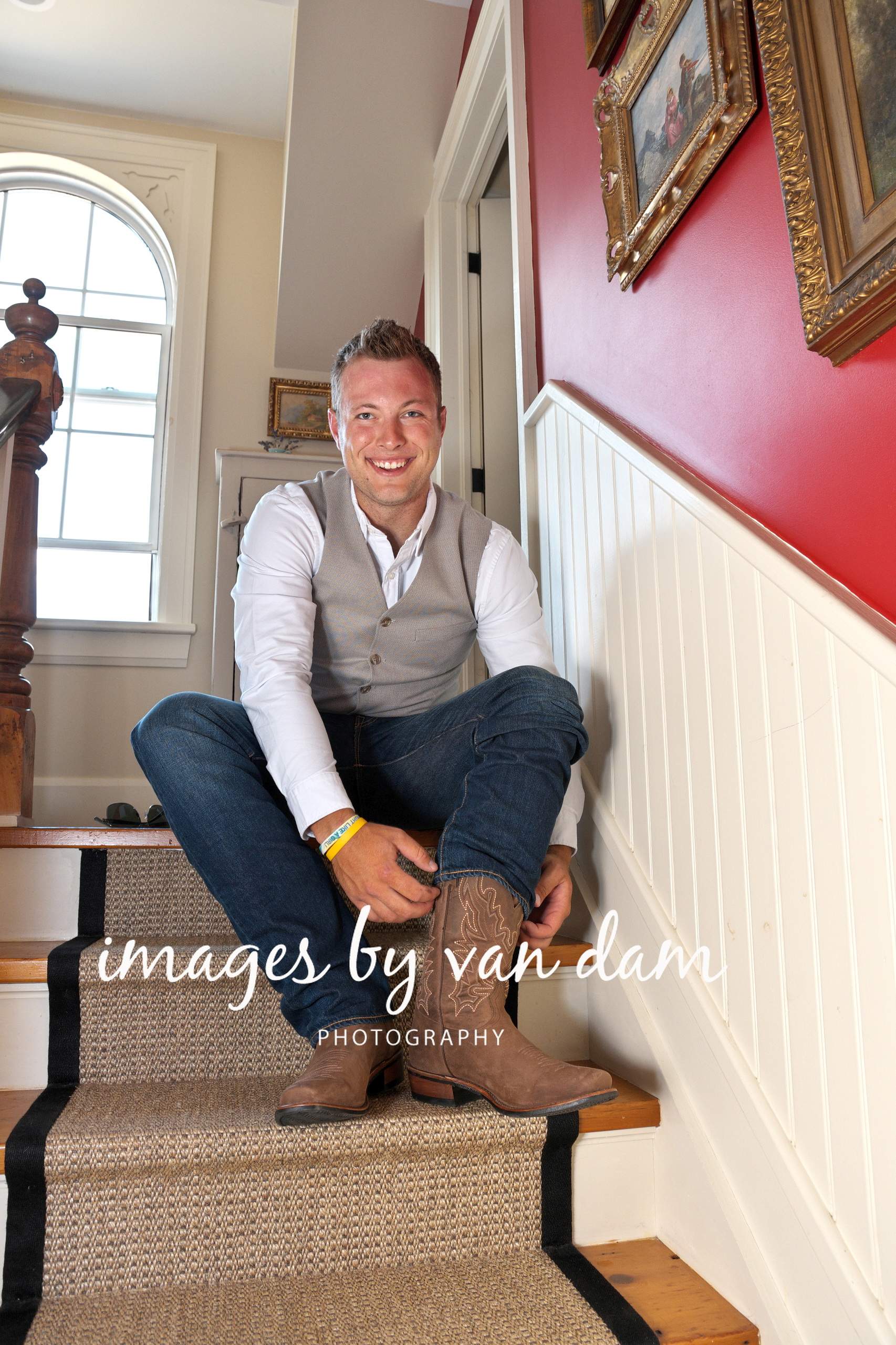 Groom puts on cowboy boots at a Kawartha Lakes country wedding