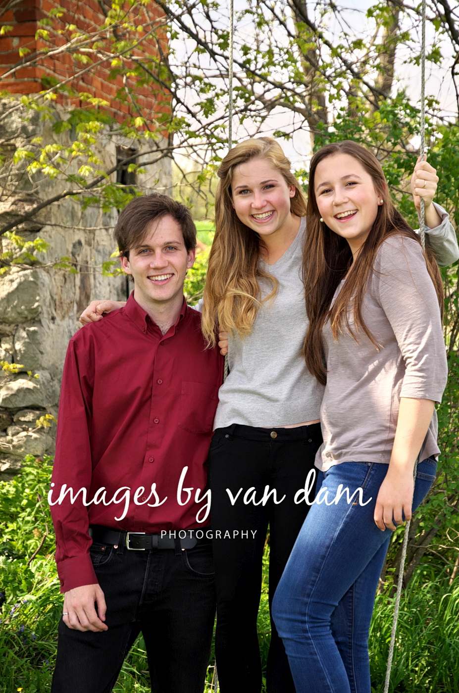 Siblings pose for a photo at the farm photographed by Barrie photographer