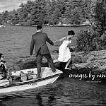 A bride hops off a motorboat onto an island for a wedding photography session