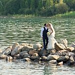bride and groom kiss on rocks near Thornbury