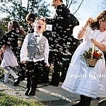 Boy catches bubbles with his mouth at Peterborough wedding