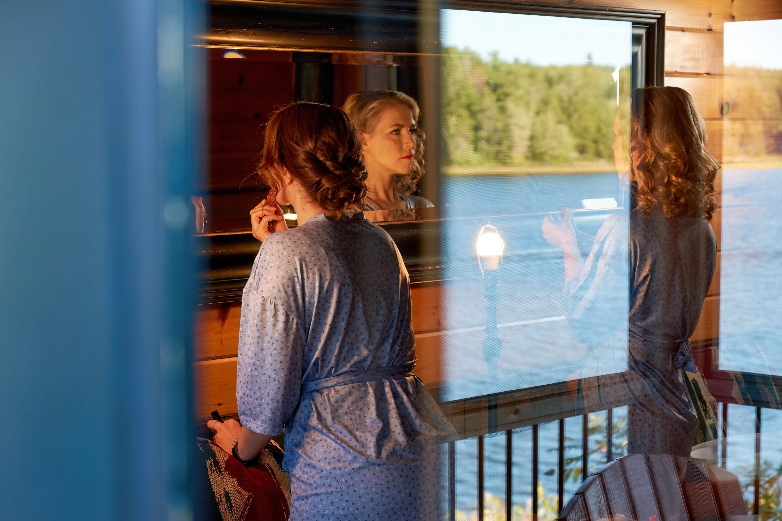 Shot Through window of Bride Getting Ready For Her Wedding at The French River Wedding