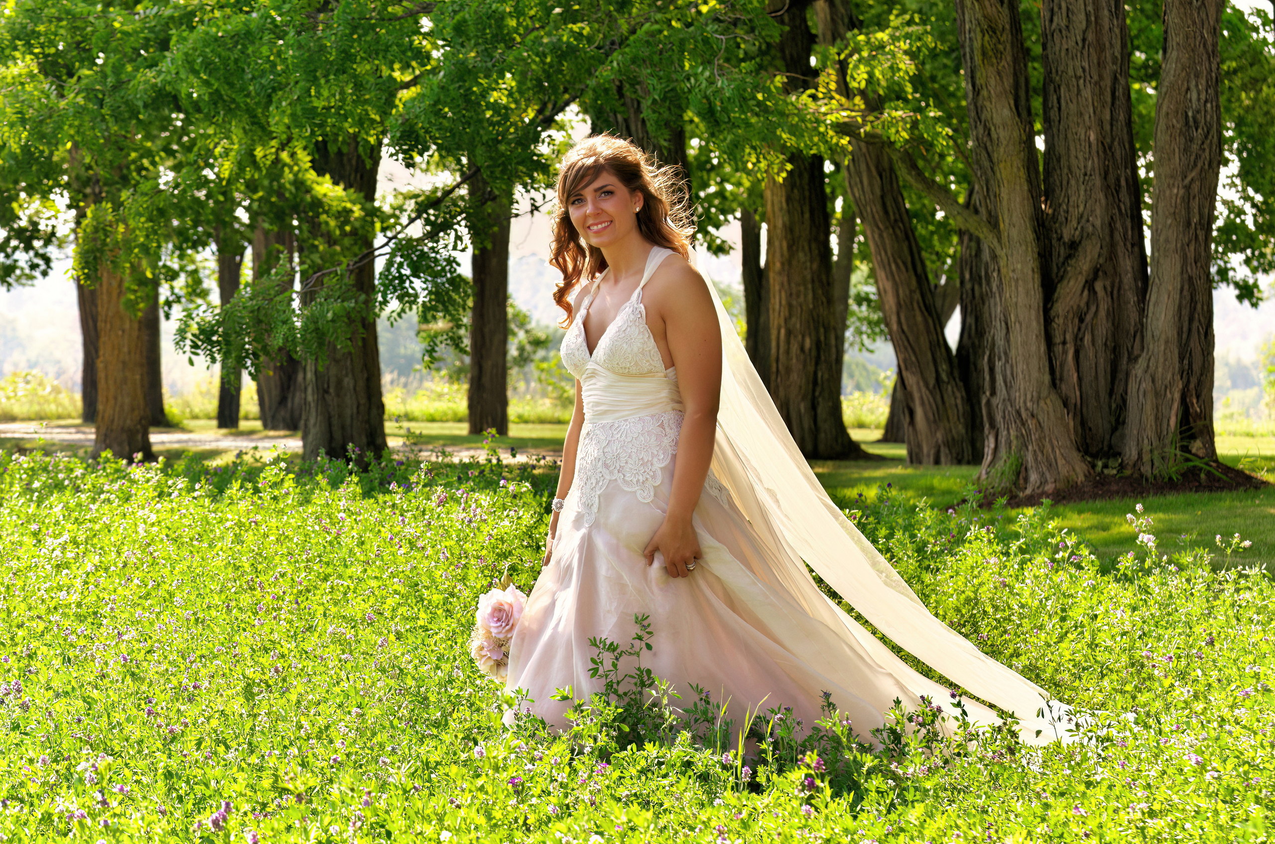 Beautiful bride in field at Omemee country wedding