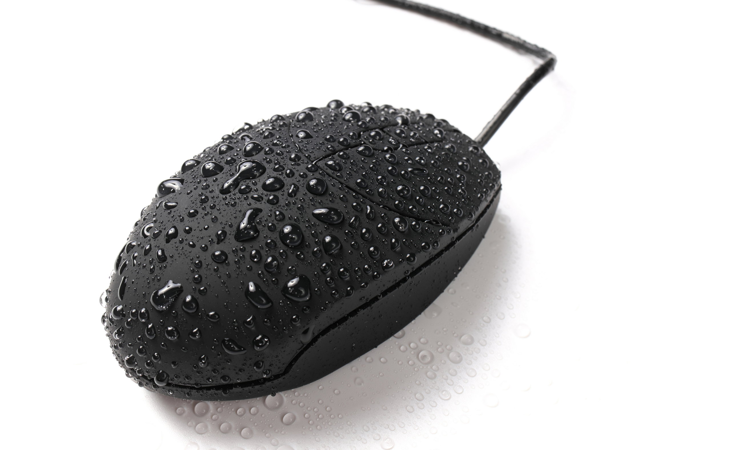 A computer mouse covered in water droplets
